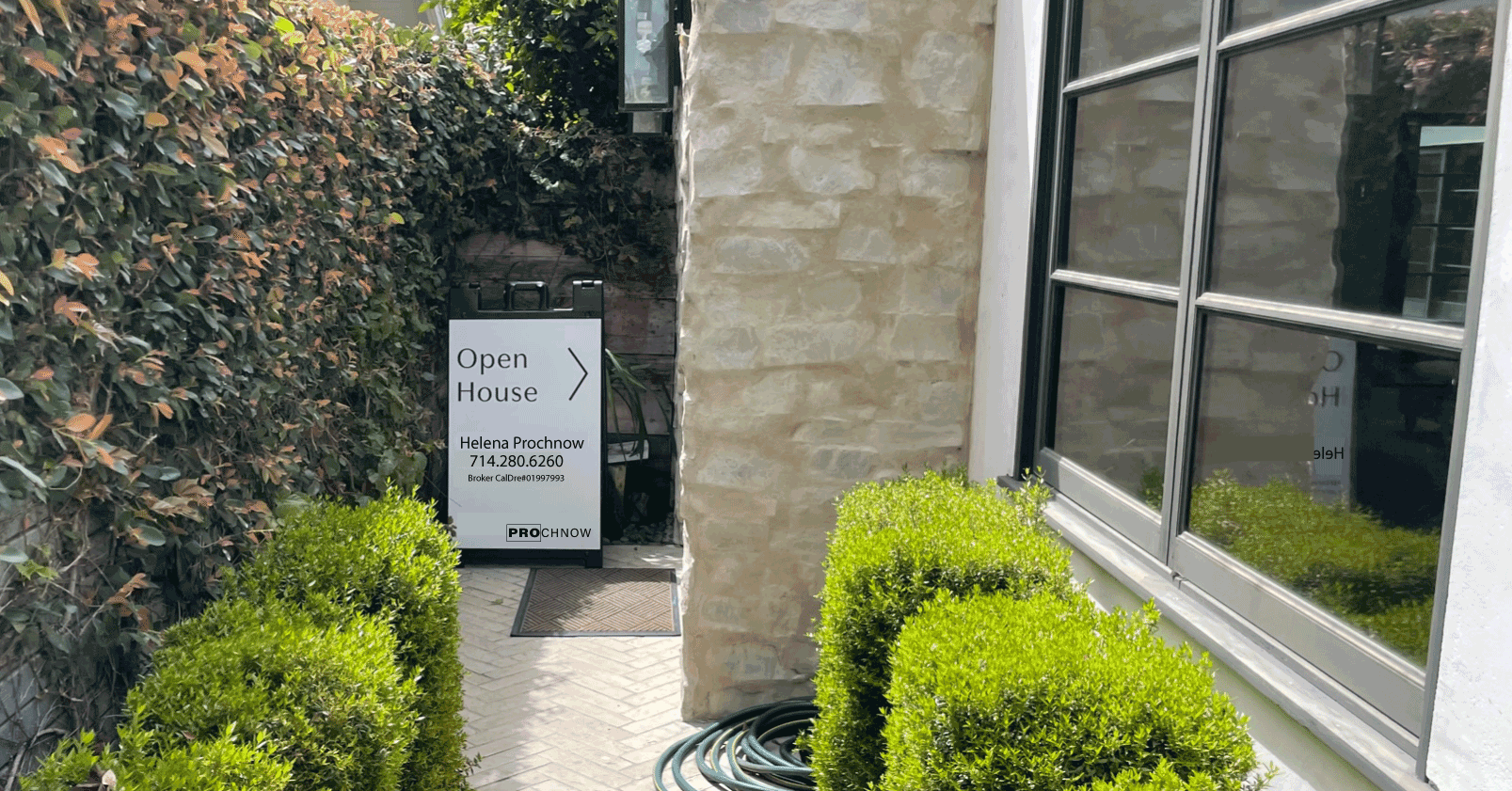 open house sign in front of the house