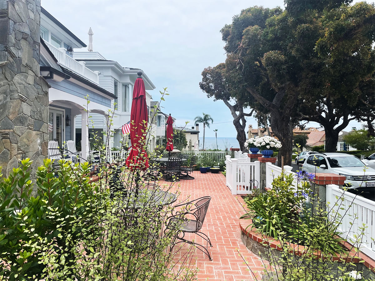 a row of houses with an ocean views and beach access in Corona Del Mar, Ca.